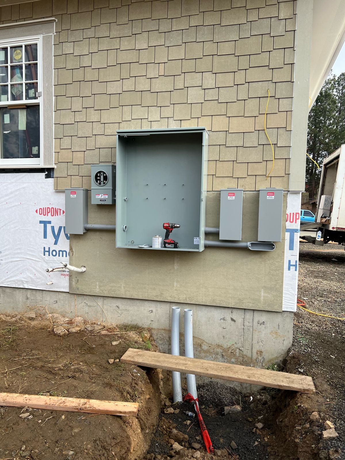 New-construction service with CT can, meter, disconnects and conduit in a trench