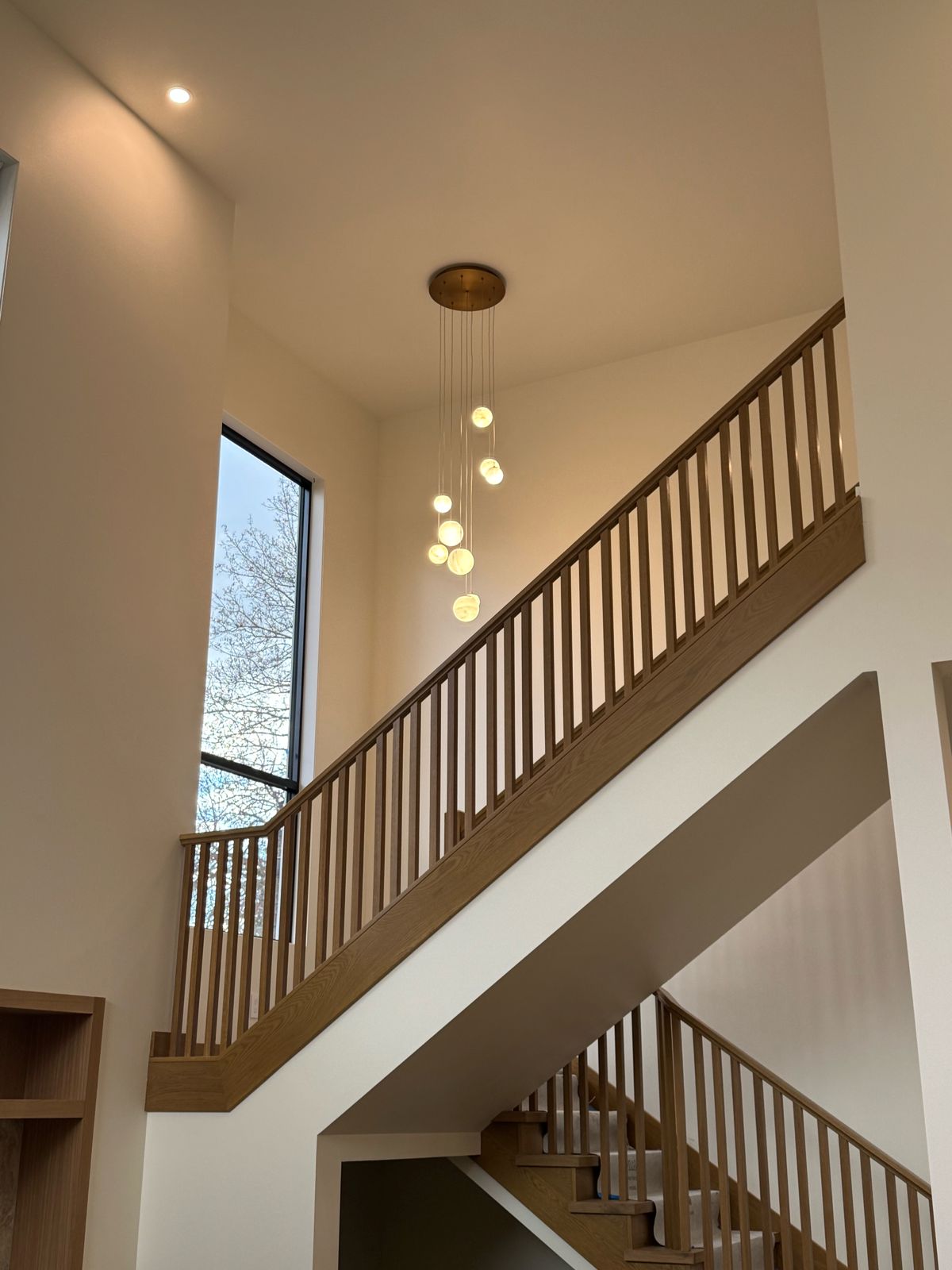 Orb Chandelier Over the Stairs