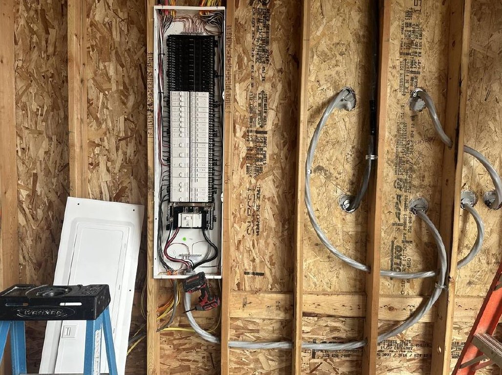 Electrical panel and wiring rough-in on an open framed wall