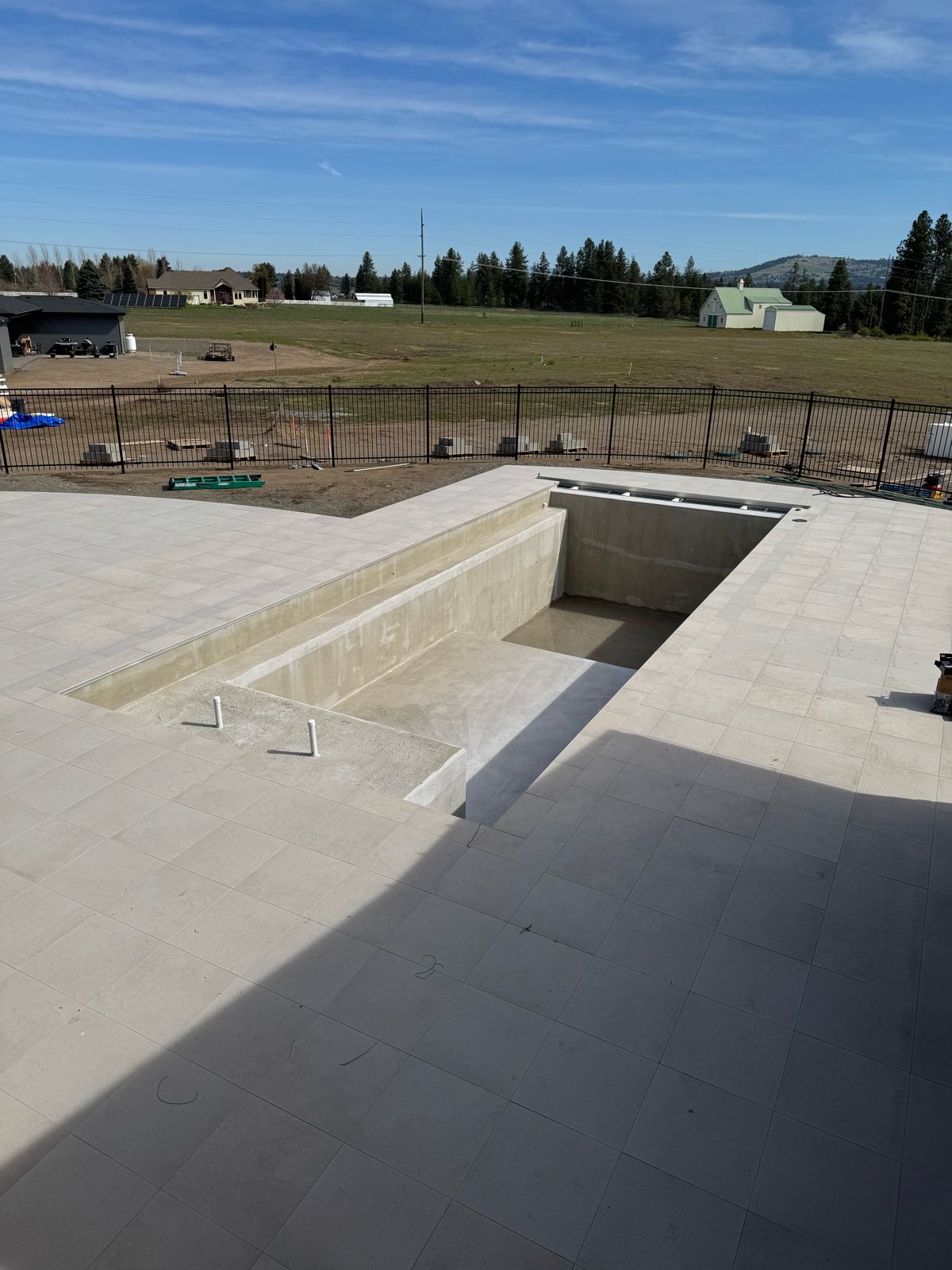 Pool shell with a tiled deck during construction