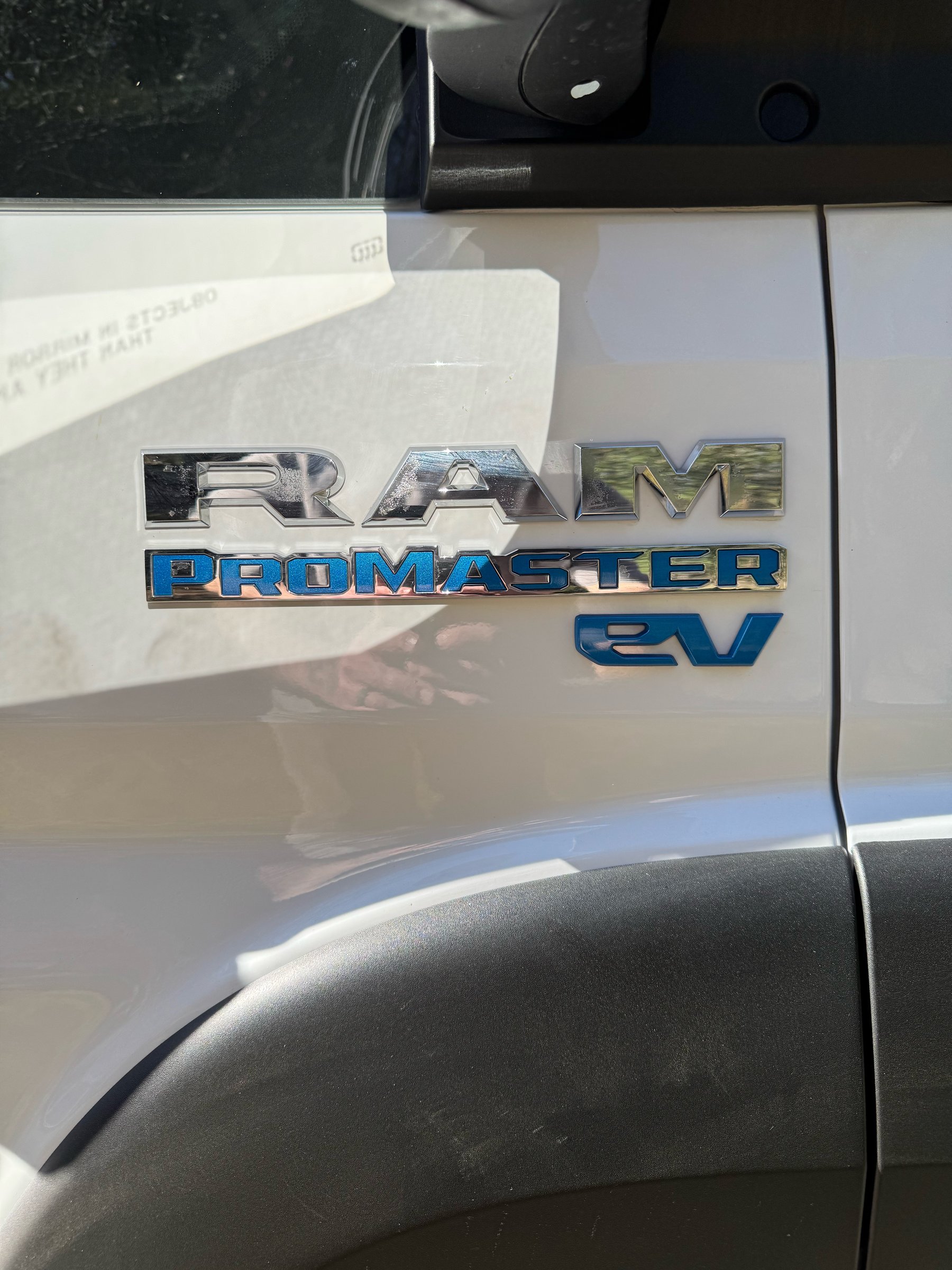 RAM ProMaster EV badge on the side of the van