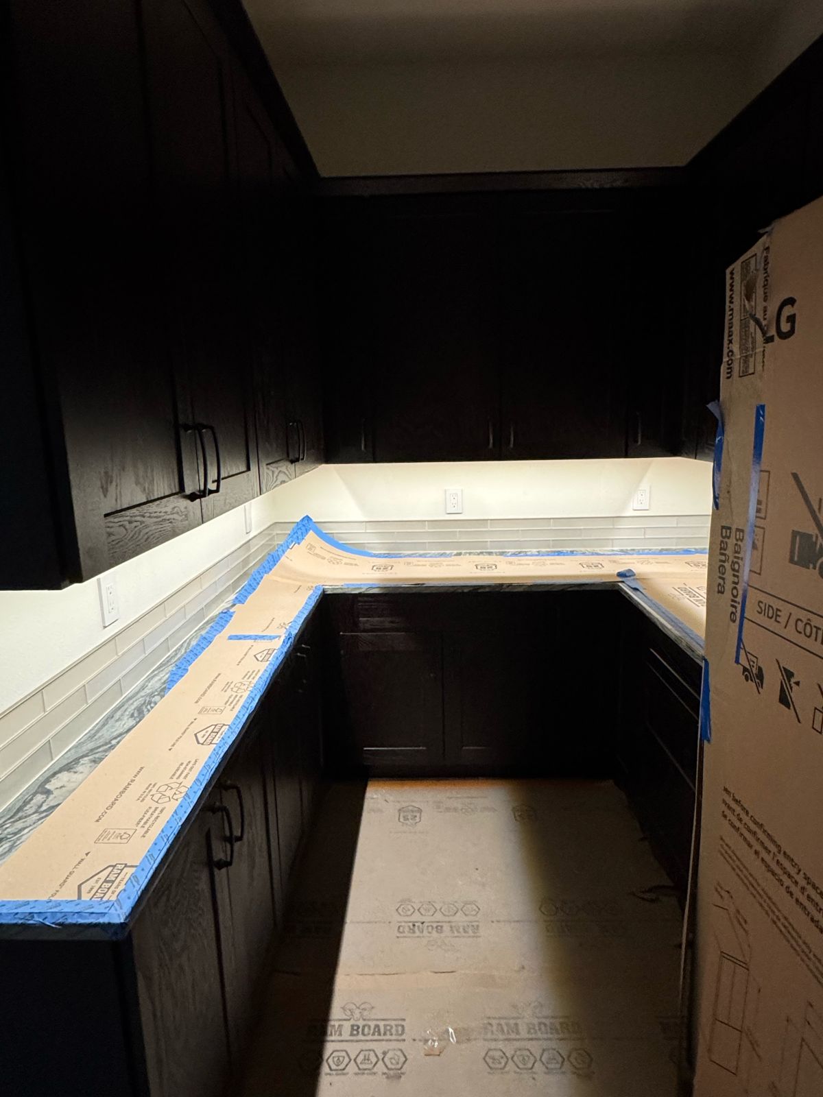 LED under-cabinet lighting beneath dark cabinets